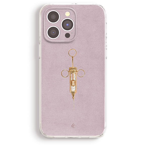 a pink iphone case with a gold syringe on it