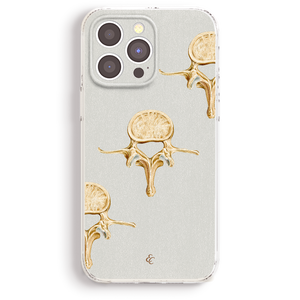 a phone case with a gold design on it