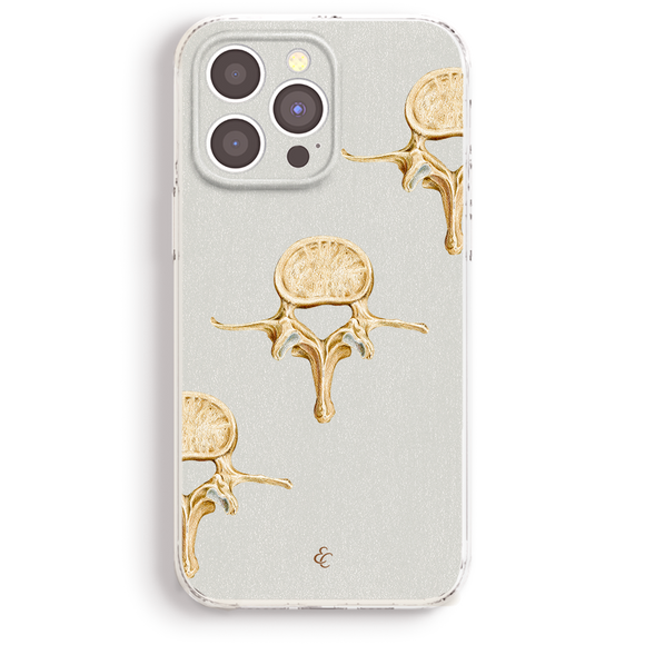 a phone case with a gold design on it