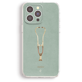 an iphone case with a gold necklace on it