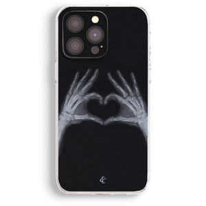 a phone case with a skeleton hand holding a heart