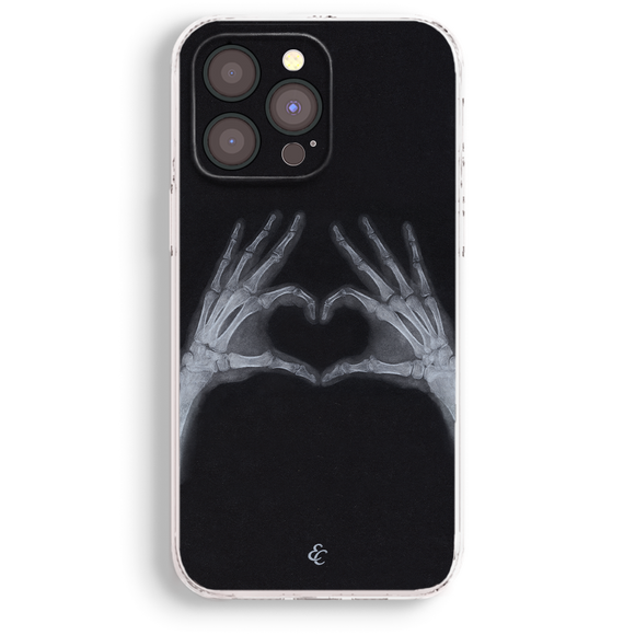 a phone case with a skeleton hand holding a heart