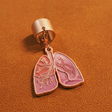 Angled view of a pink lung anatomy stethoscope charm